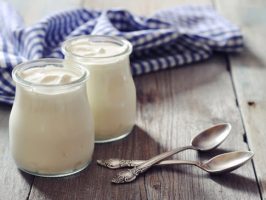 jars-of-yogurt-on-a-wooden-table